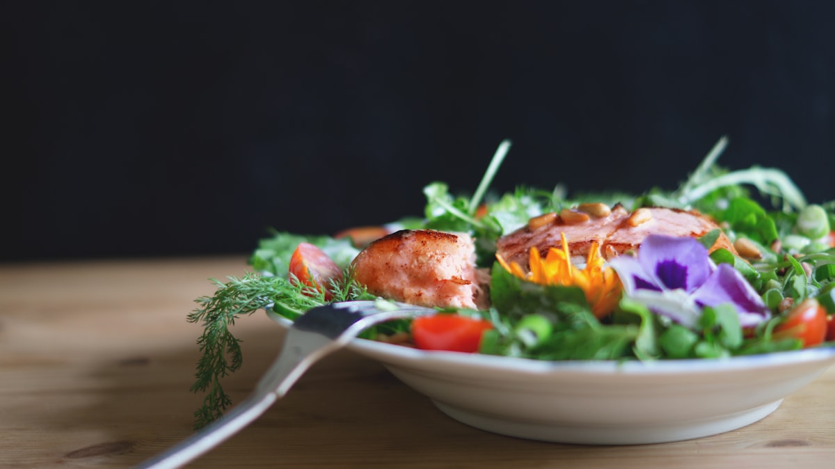 Nutritionist meal planning consultation showing fresh vegetables and healthy food